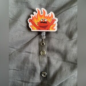 New Flame Elmo Badge Reel